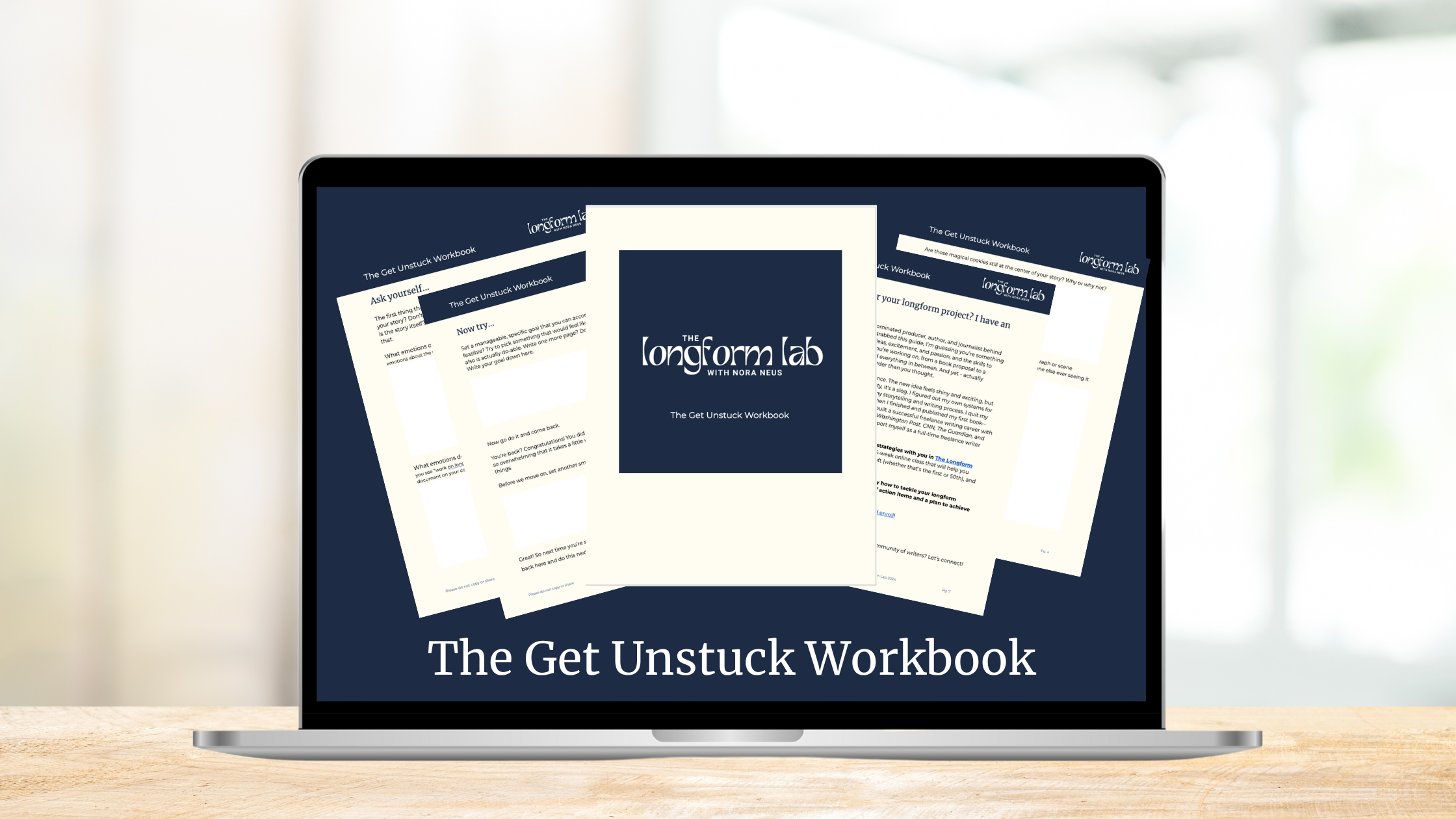 Laptop on a desk with a preview of the Get Unstuck Workbook on the screen.